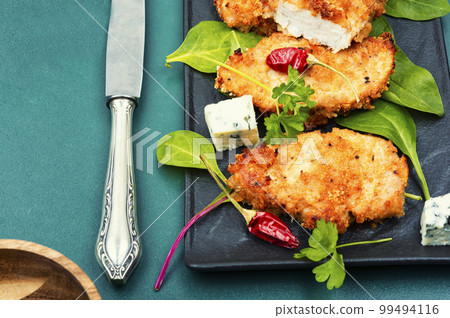 Fried chicken strips in breadcrumbs Fried chicken strips in breadcrumbs 99494116