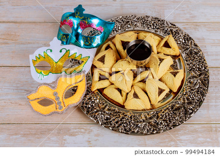 Purim festival Jewish holiday religious with cookies shofar tallit carnival mask hamantaschen celebration symbols 99494184