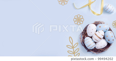 Easter egg and cake on grey table background. Easter egg and cake on grey table background. 99494202