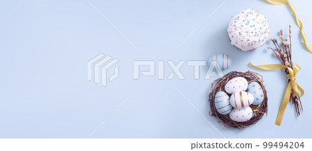 Easter egg and cake on grey table background. Easter egg and cake on grey table background. 99494204