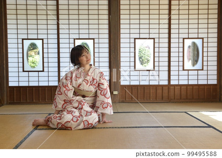 A young and beautiful woman in a yukata in a Japanese-style room A young and beautiful woman in a yukata in a Japanese-style room 99495588