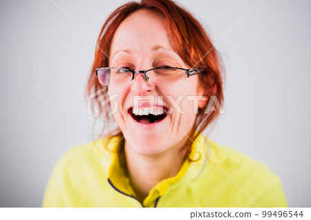 Funny ugly hispanic adult woman smile from a silly joke. Moron and dumb face portrait with mad gesture Funny ugly hispanic adult woman smile from a silly joke. Moron and dumb face portrait with mad gesture 99496544