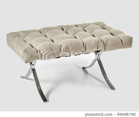 Soft grey-beige seat cushion on metal X-frame ottoman 99496740