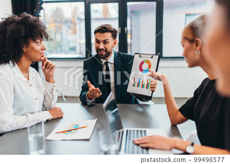 People work together as teamwork and partner with business graphs People work together as teamwork and partner with business graphs 99498577