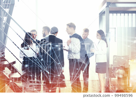 Business people work together in office with internet network effects. Concept of teamwork and partnership. double exposure Business people work together in office with internet network effects. Concept of teamwork and partnership. double exposure 99498596