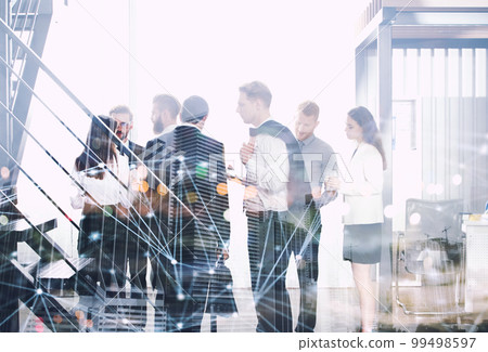 Business people work together in office with internet network effects. Concept of teamwork and partnership. double exposure Business people work together in office with internet network effects. Concept of teamwork and partnership. double exposure 99498597