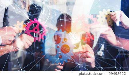 Business team connect pieces of gears. Teamwork, partnership and integration concept with network effect. double exposure Business team connect pieces of gears. Teamwork, partnership and integration concept with network effect. double exposure 99498622