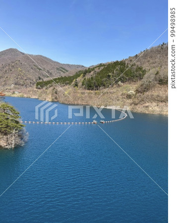 Beautiful transparent blue dam Beautiful transparent blue dam 99498985