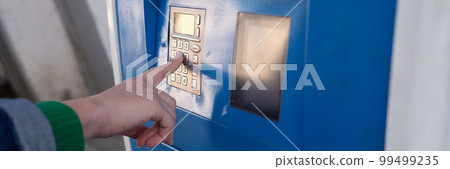 Hand is typing a pin code on ATM keyboard closeup Hand is typing a pin code on ATM keyboard closeup 99499235