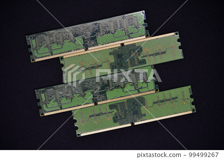 Blue RAM bars on a black background. Computer memory chips. Computer chips. Blue RAM bars on a black background. Computer memory chips. Computer chips. 99499267
