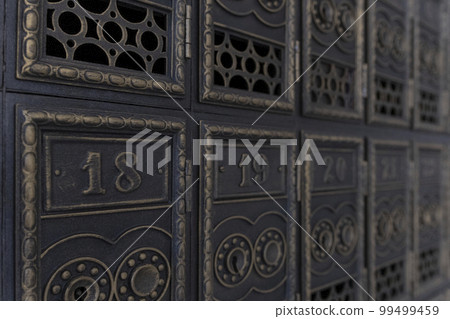 Vintage mailboxes. Old retro cells made of metal. Antique letter boxes. Copper mailboxes in the post office. Vintage mailboxes. Old retro cells made of metal. Antique letter boxes. Copper mailboxes in the post office. 99499459