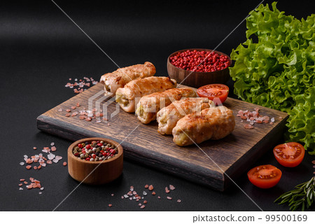 Delicious baked pork or chicken roll with mushrooms, spices and herbs Delicious baked pork or chicken roll with mushrooms, spices and herbs 99500169