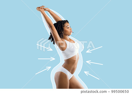 Serious young slim black lady in white lingerie enjoys weight loss result with fat abstract body around and arrows Serious young slim black lady in white lingerie enjoys weight loss result with fat abstract body around and arrows 99500650
