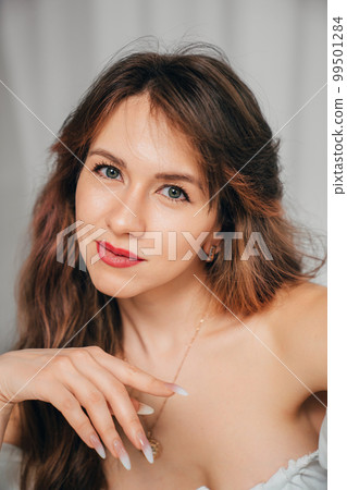 portrait of an attractive and sexy woman with long hair.  99501284