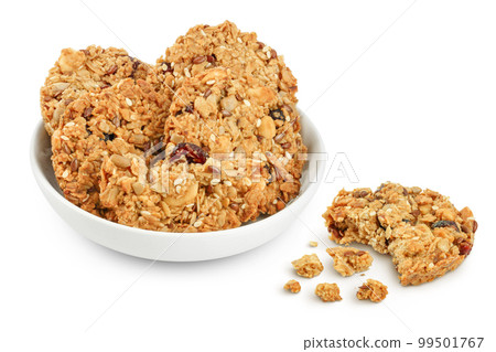 Granola cookie in ceramic bowl isolated on white background with full depth of field 99501767