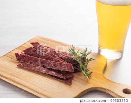 Beef tongue jerky and draft beer 99503350