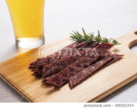 Beef tongue jerky and draft beer 99503354
