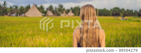 Women tourists enjoy the panoramic view of the beautiful Asian scenery of rice fields BANNER, LONG FORMAT 99504279