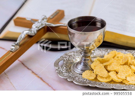 Christian Holy Communion is unleavened bread, chalice wine, symbols death resurrection of Jesus Christ 99505558
