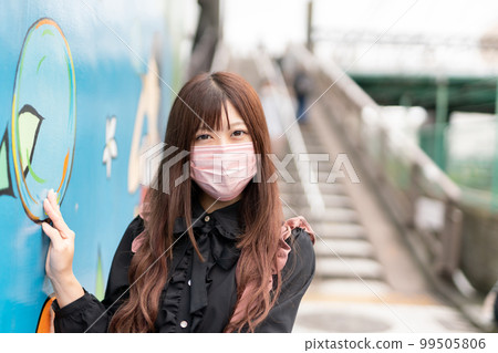 Woman in mask 99505806