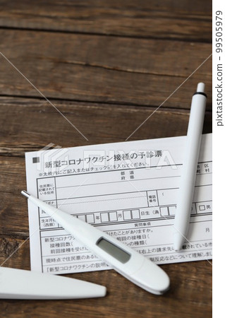 COVID-19 vaccine pre-examination form, thermometer and ballpoint pen 99505979