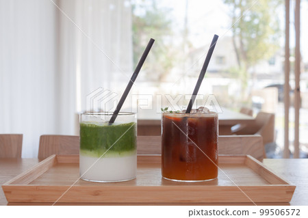 Iced americano with orange and iced matcha green tea in coffee shop Iced americano with orange and iced matcha green tea in coffee shop 99506572