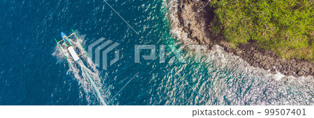 Sea bay with turquoise water and a small white beach. Beautiful lagoon and volcanic island covered with dense forest, view from above BANNER, LONG FORMAT Sea bay with turquoise water and a small white beach. Beautiful lagoon and volcanic island covered with dense forest, view from above BANNER, LONG FORMAT 99507401