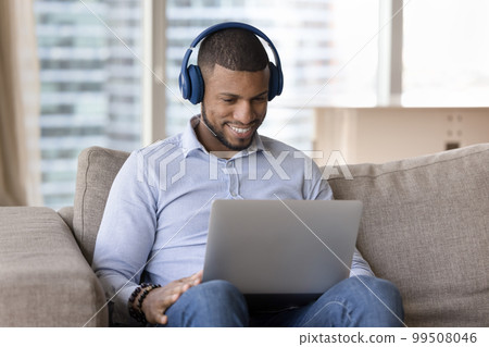 Happy millennial Black freelancer man using laptop computer Happy millennial Black freelancer man using laptop computer 99508046
