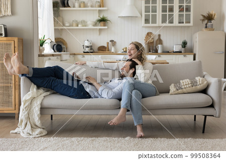 Positive millennial husband and wife enjoying romantic leisure 99508364