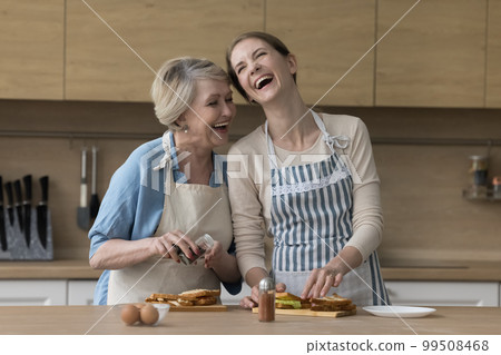 Happy excited elder mother and adult daughter woman 99508468