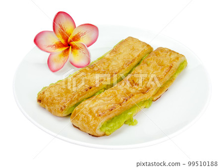 custard bread in a white plate isolated 99510188