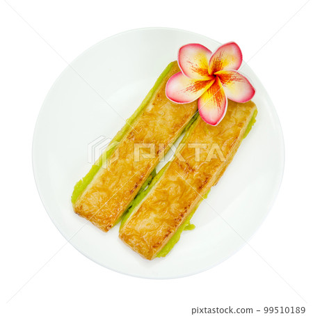custard bread in a white plate isolated 99510189