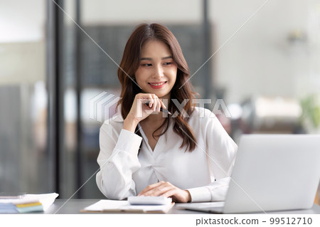 Young female work with financial papers at office count on calculator before paying taxes receipts online by phone. female employee planning budget glad to find chance for economy saving money 99512710