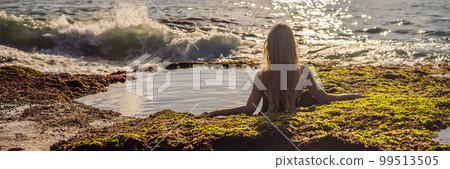 Young woman tourist on Pantai Tegal Wangi Beach sitting in a bath of sea water, Bali Island, Indonesia. Bali Travel Concept BANNER, LONG FORMAT Young woman tourist on Pantai Tegal Wangi Beach sitting in a bath of sea water, Bali Island, Indonesia. Bali Travel Concept BANNER, LONG FORMAT 99513505