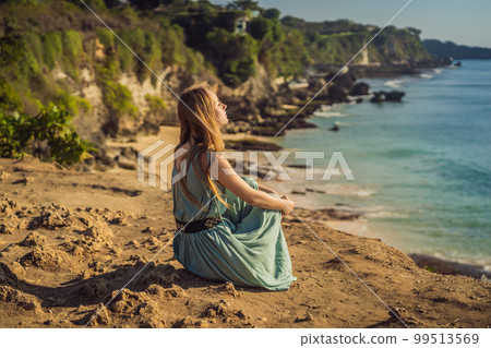 Young woman tourist on Pantai Tegal Wangi Beach, Bali Island, Indonesia. Bali Travel Concept 99513569