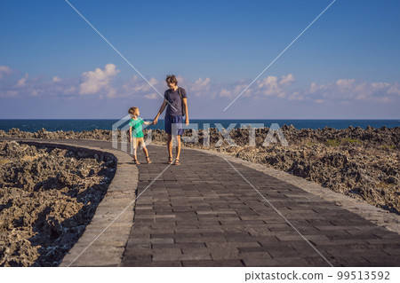 Father and son travelers on amazing Nusadua, Waterbloom Fountain, Bali Island Indonesia. Traveling with kids concept 99513592