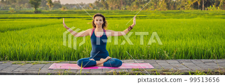 Young woman practice yoga outdoor in rice fields in the morning during wellness retreat in Bali BANNER, LONG FORMAT Young woman practice yoga outdoor in rice fields in the morning during wellness retreat in Bali BANNER, LONG FORMAT 99513656