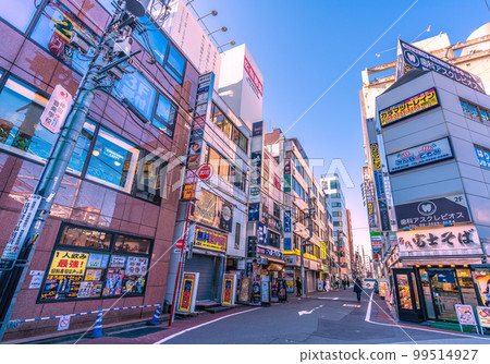 Tokyo cityscape in Japan Kanda station north exit (Yasukuni direction street exit) overlooking the streets in front of the station 99514927