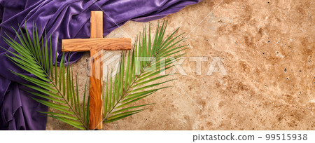Lent season, Holy week and Good friday concept. Palm leave and cross on stone background 99515938