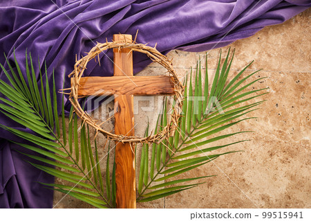 Lent season, Holy week and Good friday concept. Palm leave and cross on stone background 99515941
