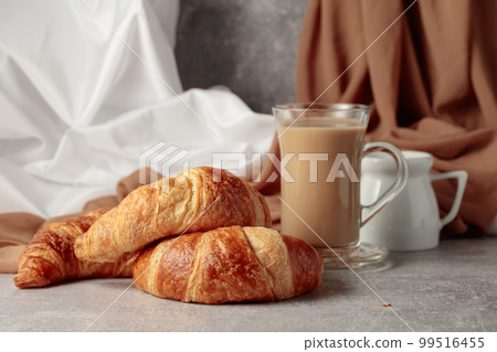 Croissants and coffee with cream. Croissants and coffee with cream. 99516455