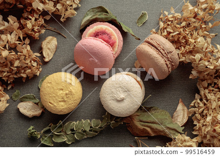 Macaroons with dried flowers. 99516459