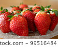 Fresh strawberries arranged in a glass bowl 99516484