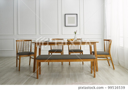 Interior with wooden dining table in white space Interior with wooden dining table in white space 99516539