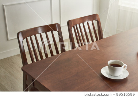 Interior with wooden dining table in white space Interior with wooden dining table in white space 99516599