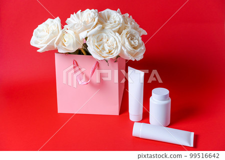 Natural white rose bouquet. Empty white hair shampoo tube with serum bottle 99516642