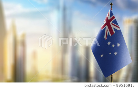 Small flags of the Australia on an abstract blurry background Small flags of the Australia on an abstract blurry background 99516913
