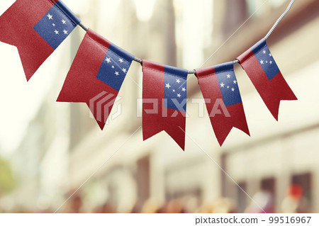 A garland of Samoa national flags on an abstract blurred background A garland of Samoa national flags on an abstract blurred background 99516967