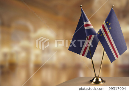 Small flags of the Cape Verde on an abstract blurry background 99517004