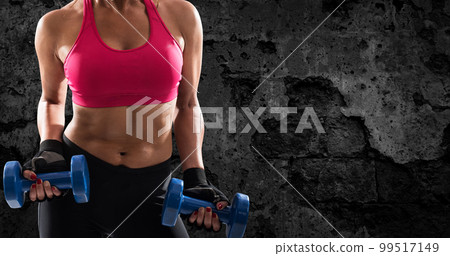Athletic woman training biceps on grunge background Athletic woman training biceps on grunge background 99517149